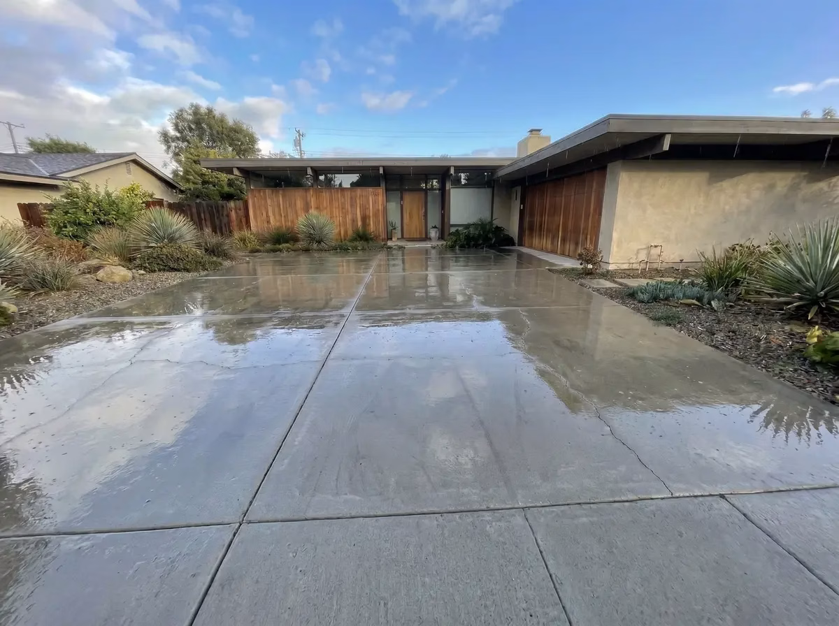 Clean restored concrete driveway after pressure washing — National Multi Steam